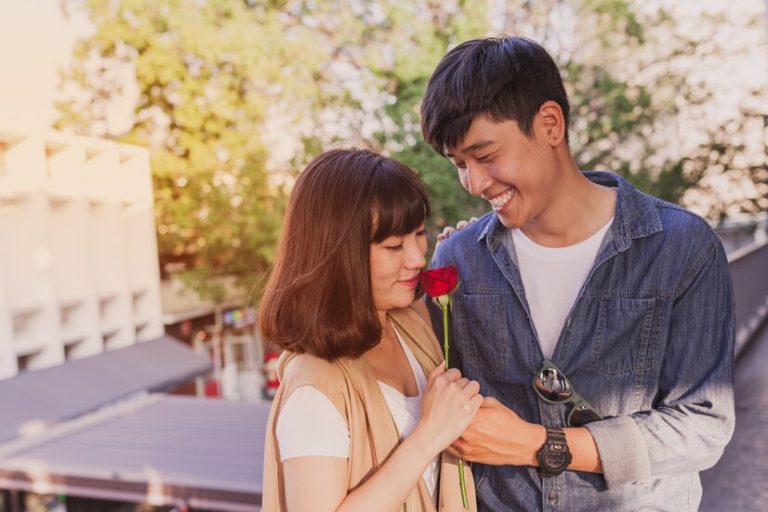 adorable-couple-with-rose-hands_23-2147592895